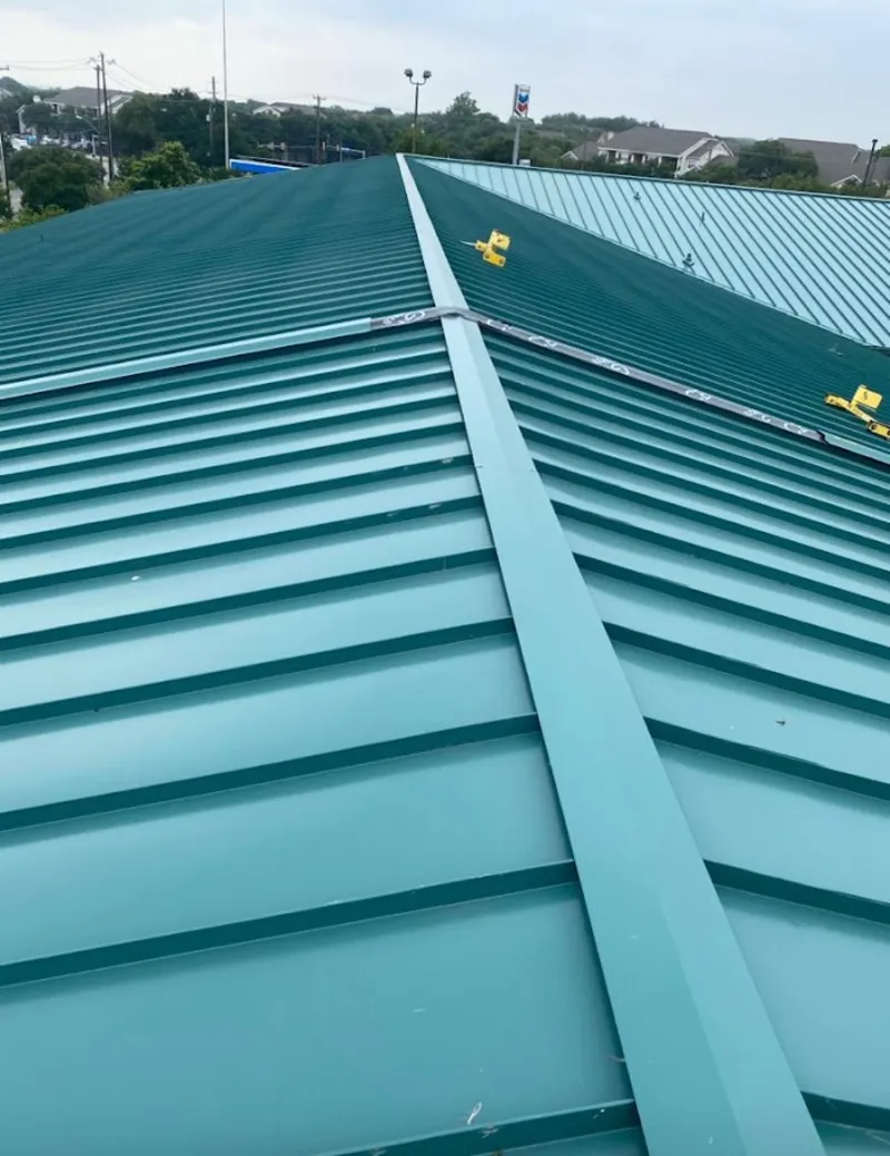 Green commercial metal roof ridge and valley for Metal Roof Repair in Wilton